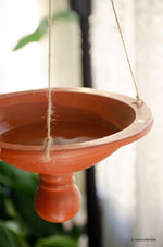Clay bird feeder