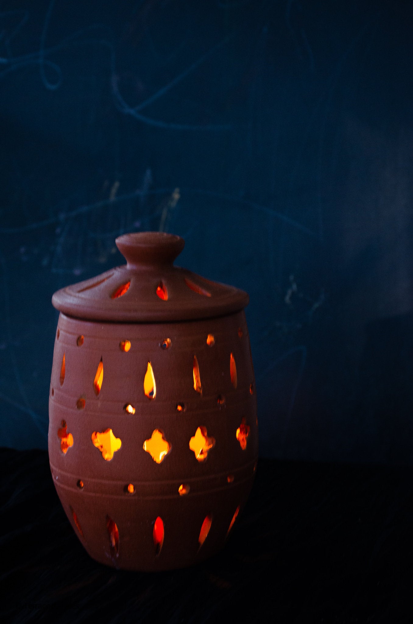 Tara Handmade Terracotta Candleholder with cutout pattern